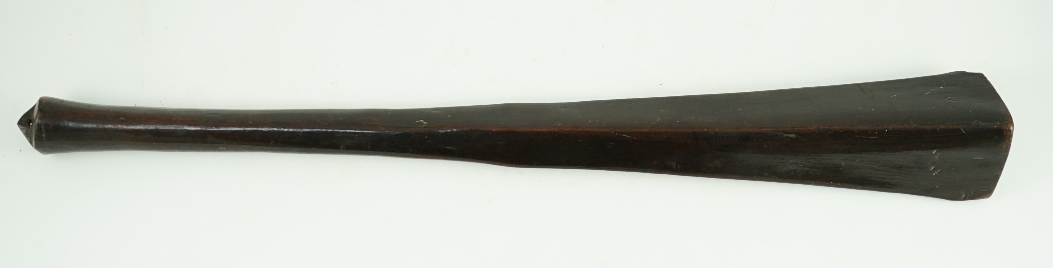 A Bowai Fijian hardwood war club, of tapered triangular section with rounded handle, 65cms long